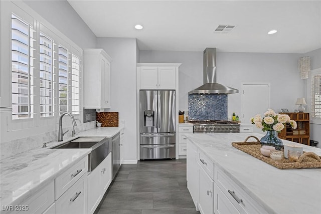 6173 Sabine Ranch Rd, Las Vegas, NV 89131 - kitchen with appliances with stainless steel finishes, wall chimney exhaust hood, a sink, plenty of natural light, and recessed lighting