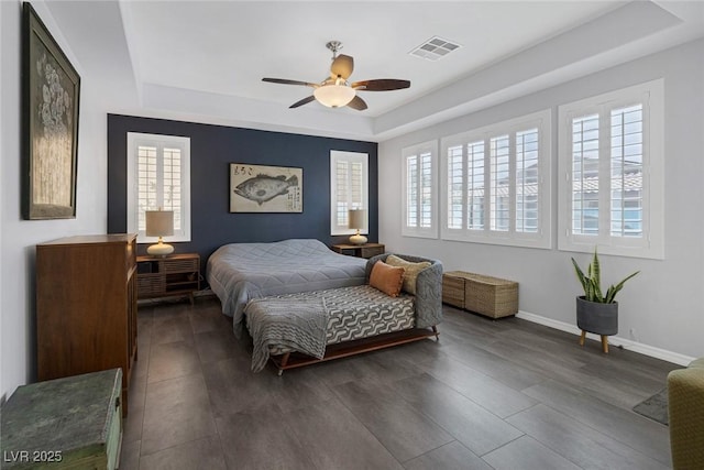 6173 Sabine Ranch Rd, Las Vegas, NV 89131 - bedroom featuring a tray ceiling, wood finished floors, baseboards, and ceiling fan