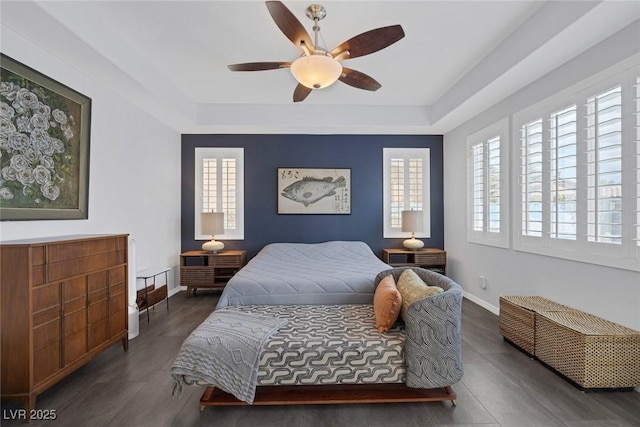 6173 Sabine Ranch Rd, Las Vegas, NV 89131 - bedroom with a raised ceiling, wood finished floors, and baseboards