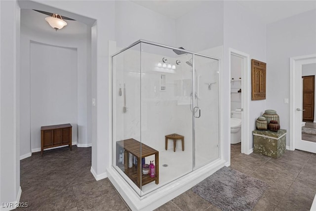 6173 Sabine Ranch Rd, Las Vegas, NV 89131 - bathroom featuring toilet, a stall shower, and tile patterned floors