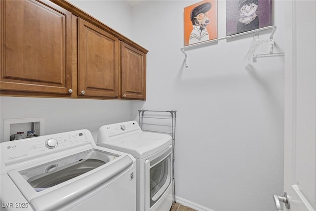 6173 Sabine Ranch Rd, Las Vegas, NV 89131 - laundry area featuring washer and clothes dryer, cabinet space, and baseboards