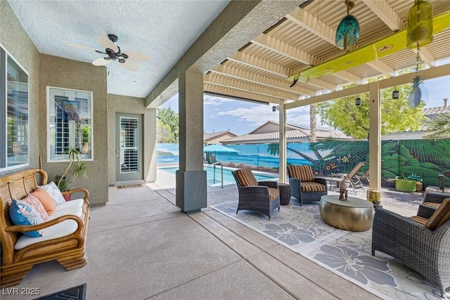 6173 Sabine Ranch Rd, Las Vegas, NV 89131 - fenced backyard featuring a pergola, a ceiling fan, a patio, and an outdoor hangout area