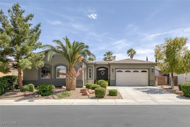 6173 Sabine Ranch Rd, Las Vegas, NV 89131 - view of front of house featuring a garage, concrete driveway, and stucco siding
