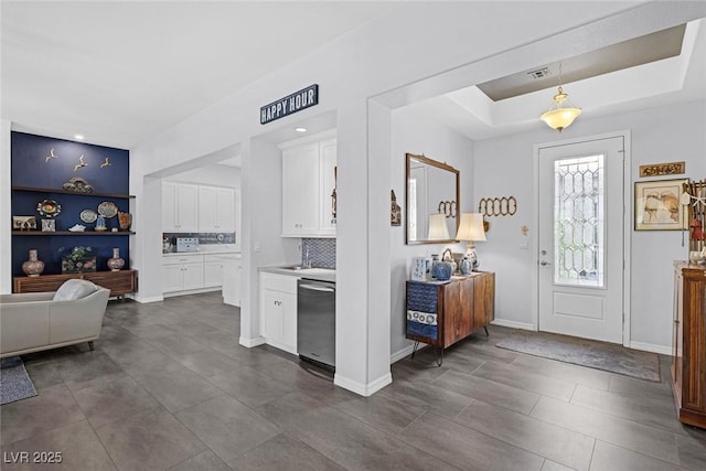 6173 Sabine Ranch Rd, Las Vegas, NV 89131 - foyer featuring a tray ceiling, baseboards, and dark tile patterned flooring