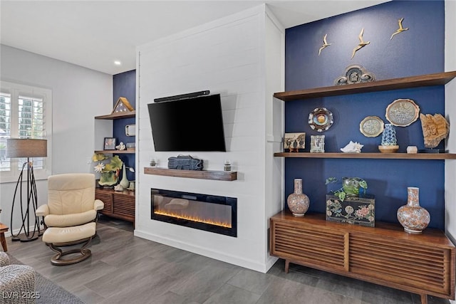6173 Sabine Ranch Rd, Las Vegas, NV 89131 - living area featuring a large fireplace, wood finished floors, and recessed lighting