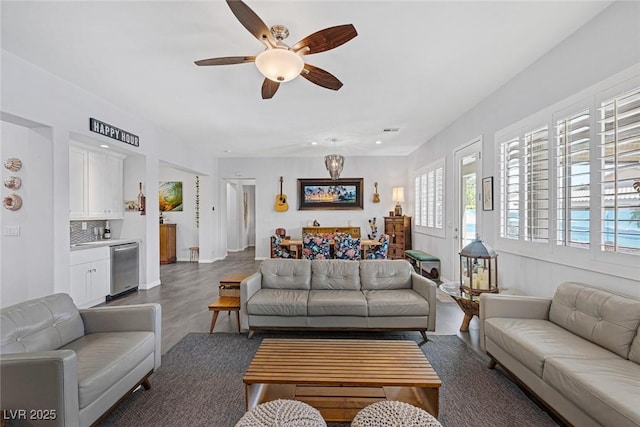 6173 Sabine Ranch Rd, Las Vegas, NV 89131 - living room with ceiling fan and dark wood-type flooring
