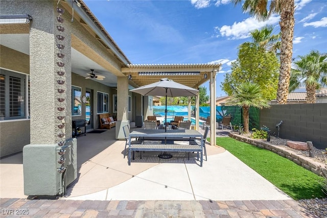 6173 Sabine Ranch Rd, Las Vegas, NV 89131 - fenced backyard with a patio area, ceiling fan, outdoor dining area, and outdoor lounge area