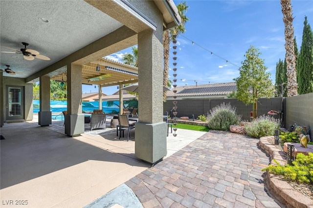 6173 Sabine Ranch Rd, Las Vegas, NV 89131 - fenced backyard featuring a patio and a ceiling fan