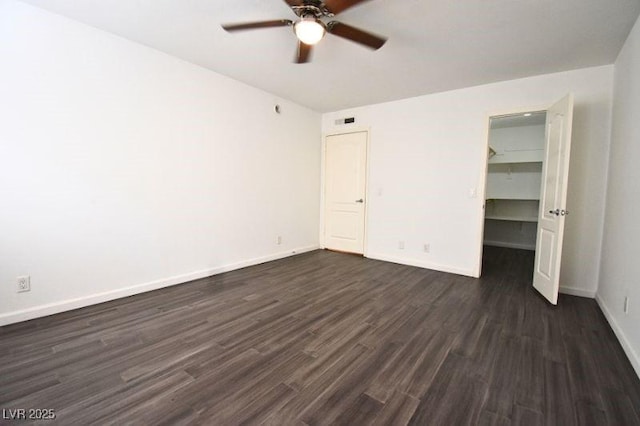 634 Oakmont Ave Unit 1903, Las Vegas, NV 89109 - unfurnished bedroom featuring dark wood-type flooring, baseboards, a closet, a spacious closet, and ceiling fan
