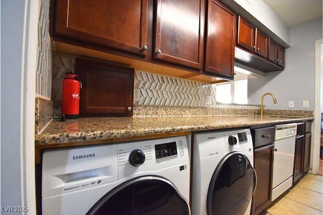 634 Oakmont Ave Unit 1903, Las Vegas, NV 89109 - washroom with washing machine and dryer and light tile patterned flooring