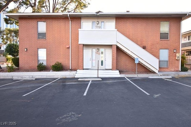 634 Oakmont Ave Unit 1903, Las Vegas, NV 89109 - view of building exterior featuring uncovered parking and stairs
