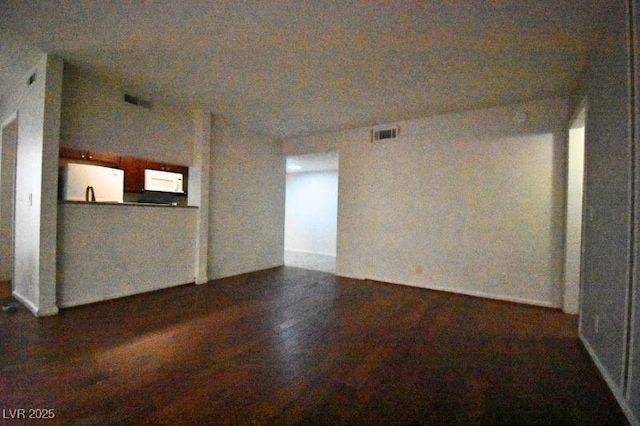 634 Oakmont Ave Unit 1903, Las Vegas, NV 89109 - unfurnished living room with wood finished floors