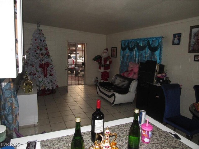 2409 Maroney Ave, Las Vegas, NV 89104 - tiled living room featuring concrete block wall