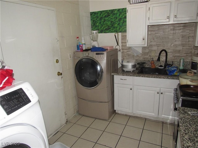 2409 Maroney Ave, Las Vegas, NV 89104 - laundry area featuring light tile patterned flooring and independent washer and dryer