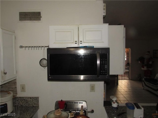 2409 Maroney Ave, Las Vegas, NV 89104 - kitchen view of stainless steel microwave and white cabinetry