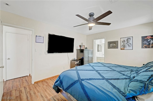 5236 Krista Alethea St, North Las Vegas, NV 89031 - bedroom with light wood-style floors, ceiling fan, baseboards, and connected bathroom