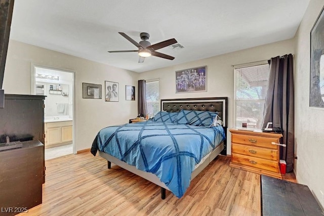 5236 Krista Alethea St, North Las Vegas, NV 89031 - bedroom featuring light wood-type flooring, multiple windows, a ceiling fan, and ensuite bath