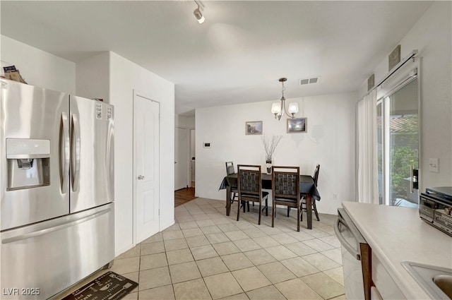 5236 Krista Alethea St, North Las Vegas, NV 89031 - dining space with a chandelier, light tile patterned floors, and rail lighting