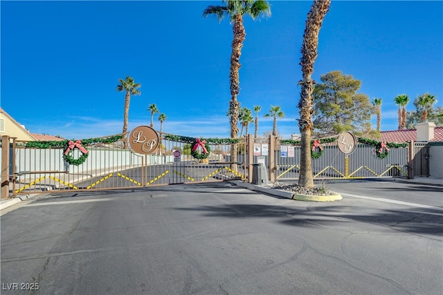 5236 Krista Alethea St, North Las Vegas, NV 89031 - view of asphalt street featuring a gate, a gated entry, and curbs