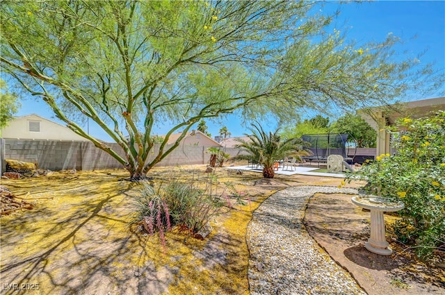 5236 Krista Alethea St, North Las Vegas, NV 89031 - fenced backyard featuring a trampoline