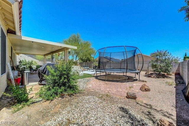 5236 Krista Alethea St, North Las Vegas, NV 89031 - fenced backyard with a trampoline