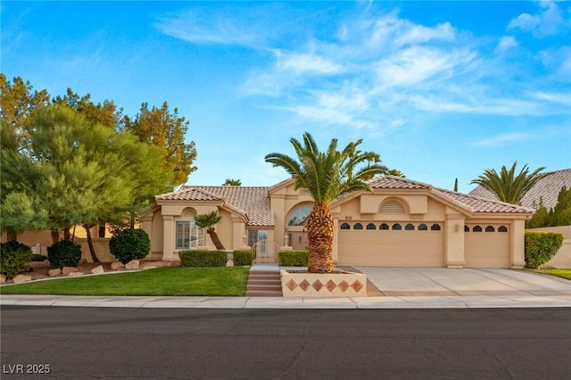 1913 Madagascar Ln, Las Vegas, NV 89117 - mediterranean / spanish home featuring stucco siding, driveway, an attached garage, and a tiled roof