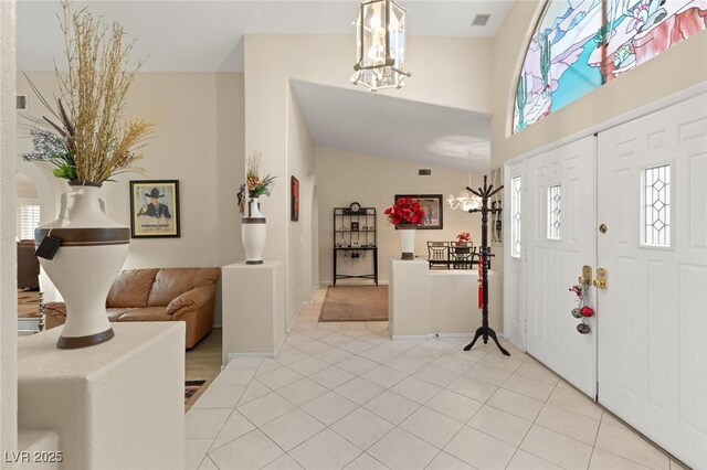 1913 Madagascar Ln, Las Vegas, NV 89117 - foyer with a chandelier, plenty of natural light, and light tile patterned floors