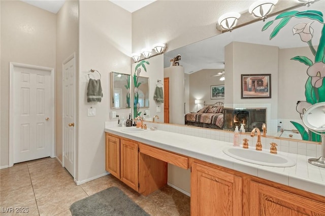 1913 Madagascar Ln, Las Vegas, NV 89117 - full bath featuring double vanity, tile patterned flooring, ensuite bathroom, and baseboards