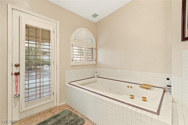 1913 Madagascar Ln, Las Vegas, NV 89117 - bathroom with a tub with jets and tile patterned floors