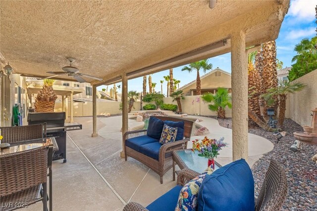 1913 Madagascar Ln, Las Vegas, NV 89117 - fenced backyard featuring a patio area, an outdoor living space, and a ceiling fan