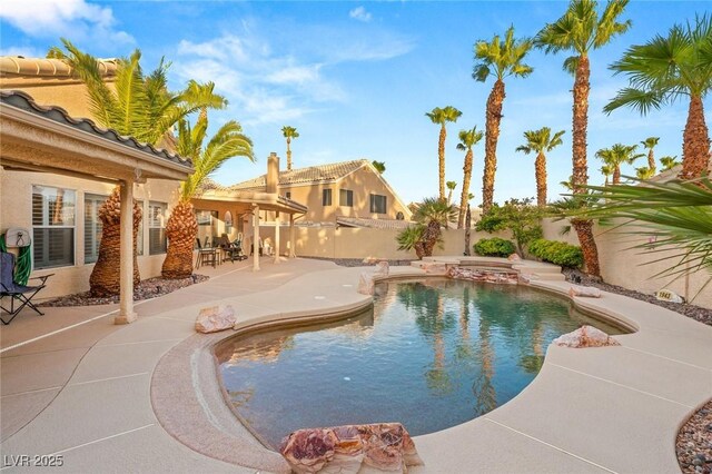 1913 Madagascar Ln, Las Vegas, NV 89117 - view of swimming pool with a patio area, a fenced backyard, and a pool with connected hot tub
