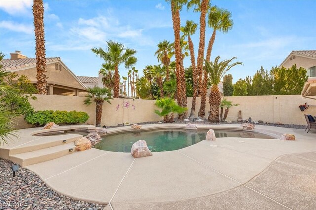 1913 Madagascar Ln, Las Vegas, NV 89117 - view of swimming pool featuring a fenced backyard, a patio, and a pool with connected hot tub
