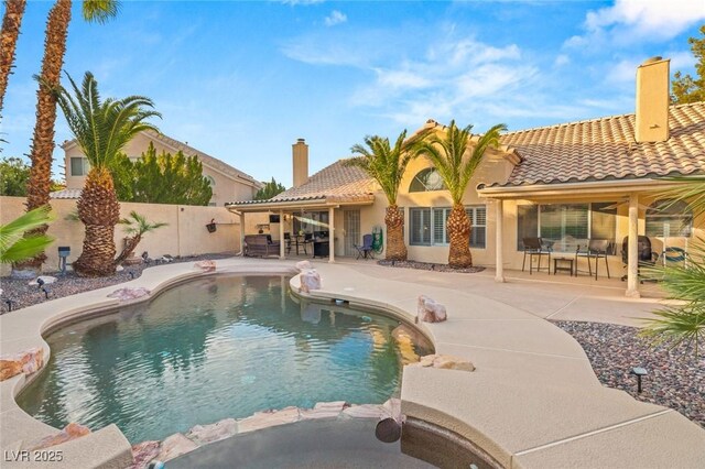 1913 Madagascar Ln, Las Vegas, NV 89117 - view of swimming pool featuring a patio, a fenced backyard, outdoor dining space, and a pool with connected hot tub