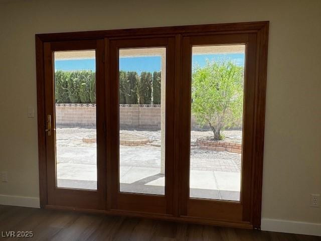 8010 Coffee Tree Ct, Las Vegas, NV 89123 - doorway featuring baseboards and wood finished floors