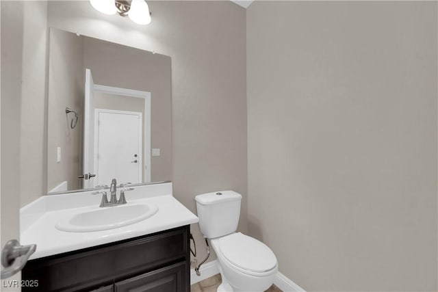 7300 Lavender Rose Ave, Las Vegas, NV 89117 - bathroom with toilet, vanity, and baseboards