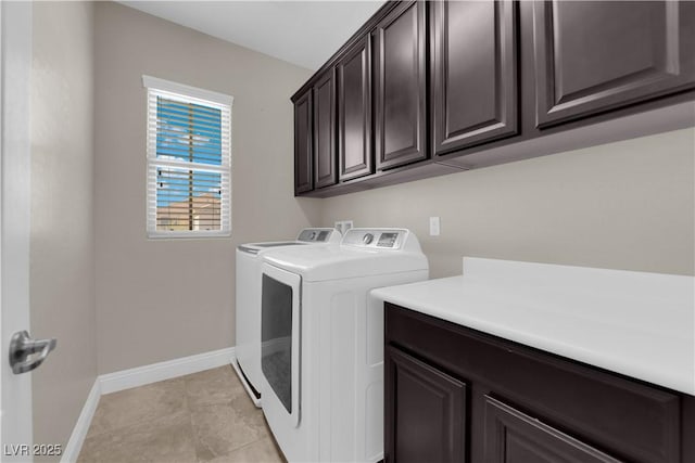 7300 Lavender Rose Ave, Las Vegas, NV 89117 - washroom featuring independent washer and dryer, cabinet space, baseboards, and light tile patterned floors