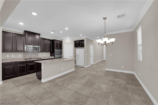 7300 Lavender Rose Ave, Las Vegas, NV 89117 - kitchen featuring appliances with stainless steel finishes, ornamental molding, a chandelier, tasteful backsplash, and recessed lighting