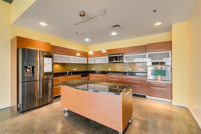 900 Las Vegas Blvd Unit 1209, Las Vegas, NV 89101 - kitchen featuring appliances with stainless steel finishes, dark countertops, modern cabinets, tasteful backsplash, and recessed lighting