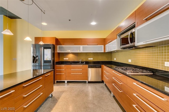 900 Las Vegas Blvd Unit 1209, Las Vegas, NV 89101 - kitchen with appliances with stainless steel finishes, modern cabinets, brown cabinetry, a sink, and recessed lighting
