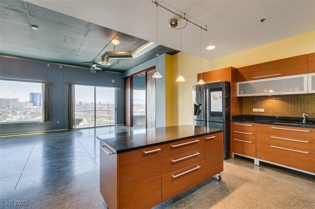 900 Las Vegas Blvd Unit 1209, Las Vegas, NV 89101 - kitchen with stainless steel fridge with ice dispenser, modern cabinets, a sink, and dark countertops