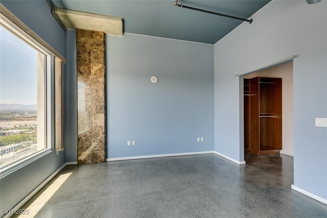 900 Las Vegas Blvd Unit 1209, Las Vegas, NV 89101 - spare room with baseboards and speckle patterned floor