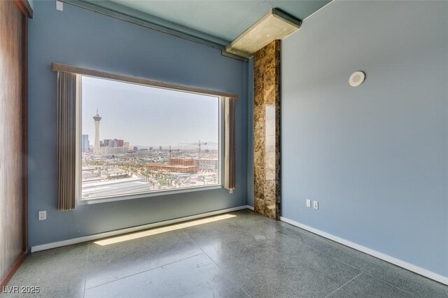 900 Las Vegas Blvd Unit 1209, Las Vegas, NV 89101 - empty room with plenty of natural light, speckled floor, and baseboards