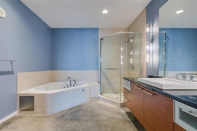 900 Las Vegas Blvd Unit 1209, Las Vegas, NV 89101 - bathroom featuring vanity, speckle patterned floor, a stall shower, a garden tub, and recessed lighting