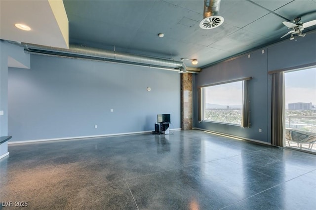 900 Las Vegas Blvd Unit 1209, Las Vegas, NV 89101 - garage featuring baseboards, a wood stove, and ceiling fan