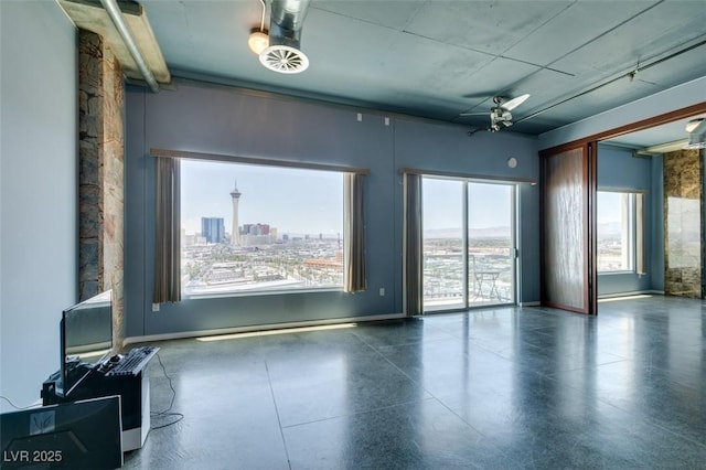 900 Las Vegas Blvd Unit 1209, Las Vegas, NV 89101 - spare room featuring a ceiling fan and baseboards