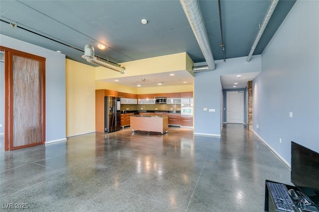 900 Las Vegas Blvd Unit 1209, Las Vegas, NV 89101 - unfurnished living room featuring light aggregate flooring and baseboards