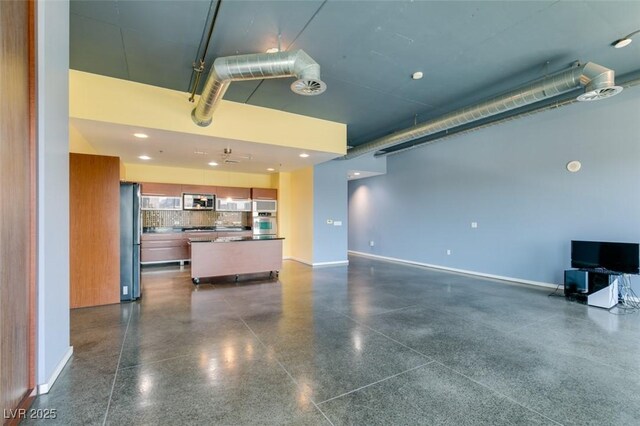 900 Las Vegas Blvd Unit 1209, Las Vegas, NV 89101 - unfurnished living room with light aggregate flooring and baseboards