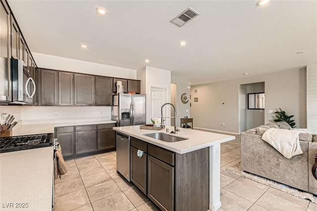 3716 W Colton Ave, North Las Vegas, NV 89032 - kitchen featuring appliances with stainless steel finishes, a sink, light tile patterned floors, open floor plan, and recessed lighting