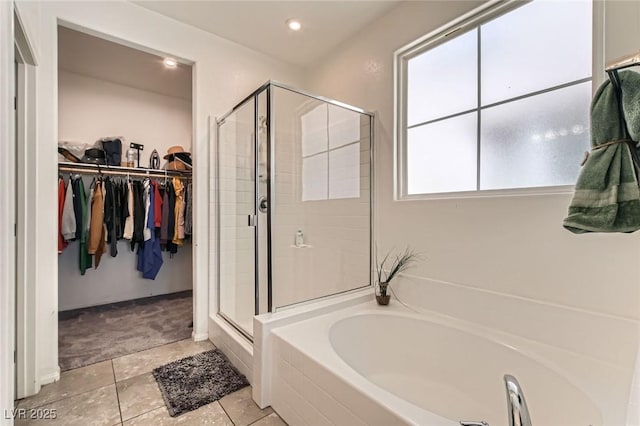 3716 W Colton Ave, North Las Vegas, NV 89032 - full bath featuring a bath, a stall shower, a walk in closet, tile patterned flooring, and recessed lighting