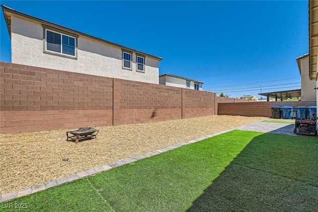 3716 W Colton Ave, North Las Vegas, NV 89032 - view of yard with an outdoor fire pit and a patio area